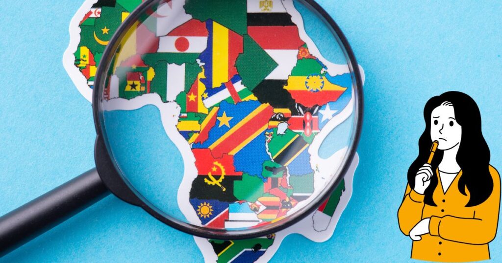 虫眼鏡とたくさんの国旗の絵と考える女性のイラスト