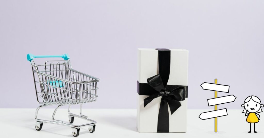 カートと黒いリボンで包装された箱の写真