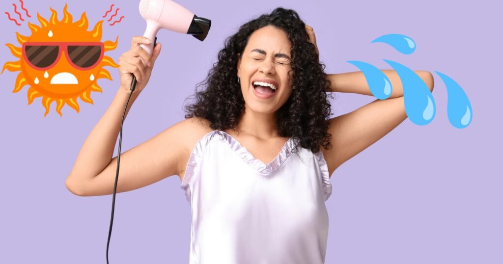 髪をドライヤーで乾かしている女性の写真