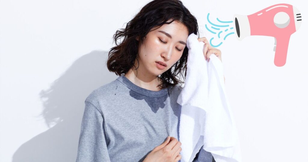 汗を拭いている女性の写真とドライヤーのイラスト