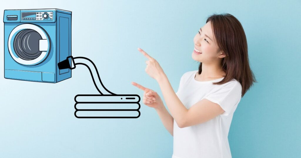 洗濯機のイラストを指さす女性